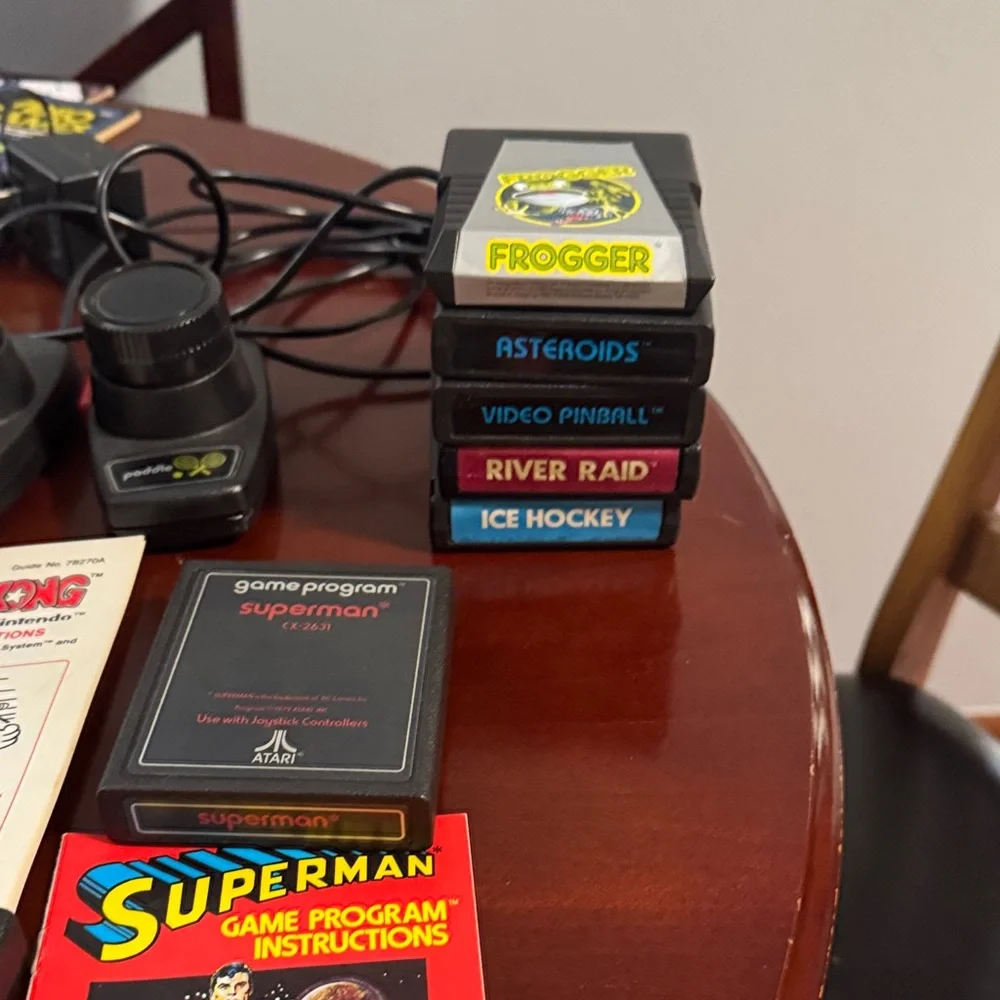 Vintage Authentic Atari 2600 with controllers, games and instruction booklets.